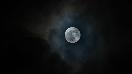 Low angle view of fullmoon with beautiful cloud