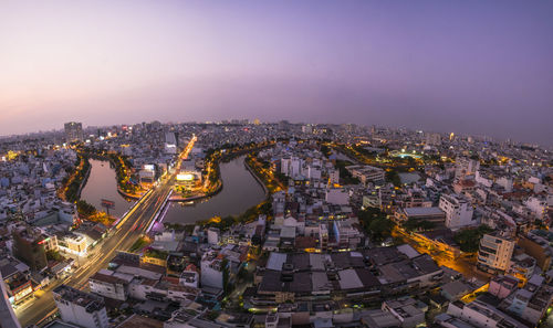 High angle view of illuminated buildings in city at night