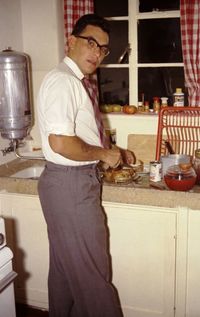 Side view of young man preparing food in restaurant