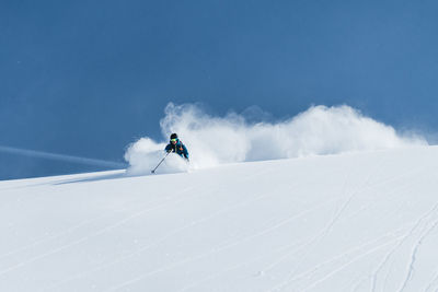 Man enjoying skiing in deep powder snow, gastein, salzburg, austria