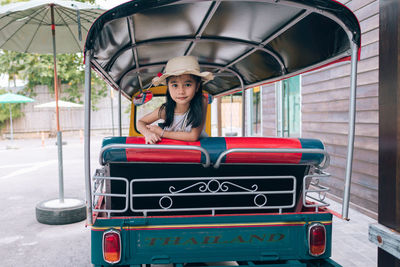 Little asian girl sitting tuk-tuk