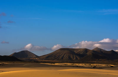 Scenic view of desert against sky