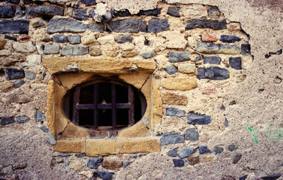 View of brick wall with hole