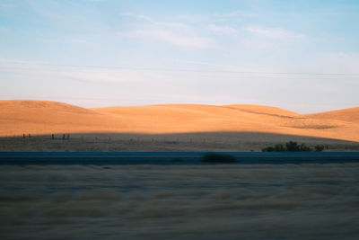 Scenic view of desert against sky