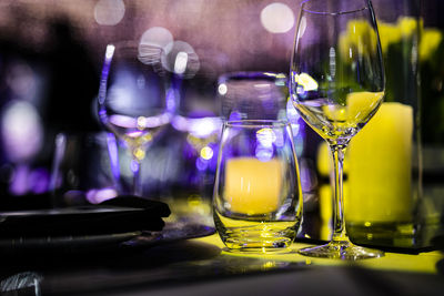 Close-up of wine glasses on table