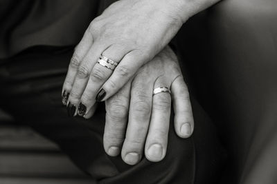 Close-up of couple stacking hands