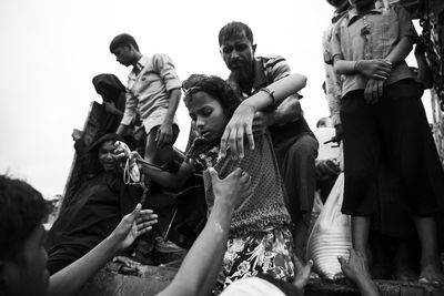 Group of people against clear sky