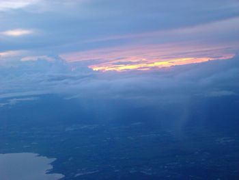 Aerial view of landscape against cloudy sky