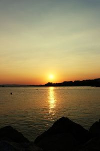 Scenic view of sea against sky during sunset