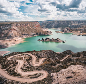 Scenic view of lake against cloudy sky