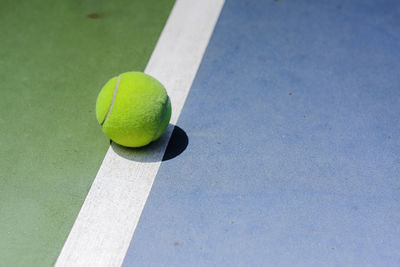 High angle view of yellow ball on table