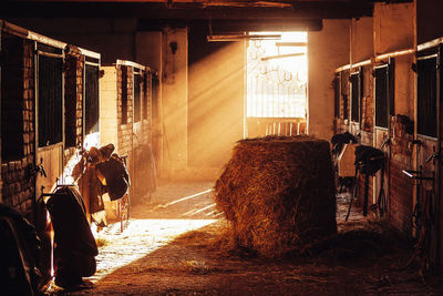 Interior of stable during sunset