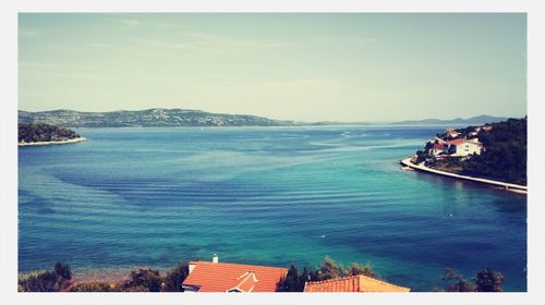 Scenic view of sea against blue sky