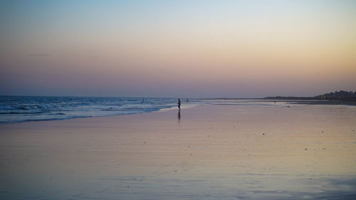 Scenic view of beach against clear sky