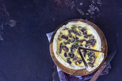 Savory tart, pie or quiche with mushrooms and cheese. homemade savory autumn bakery. 