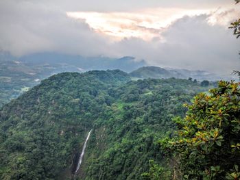 Scenic view of mountains against cloudy sky