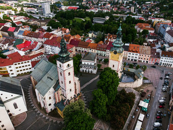 Two old town church towers beetween buildings