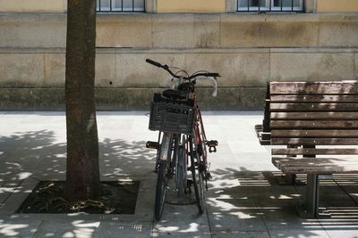 Bicycle parked on footpath during winter