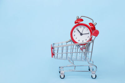 Close-up of clock against blue background