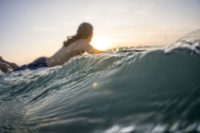 Mid twenties man surfing near punta de mita, mexico