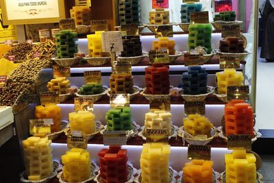 Multi colored bottles on display at store