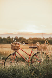 Bicycle on field against sky