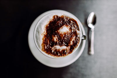 High angle view of coffee in cup on table