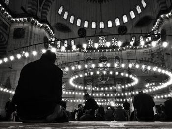 People visiting illuminated suleymaniye mosque