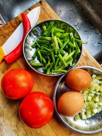 High angle view of chopped vegetables in bowl on table