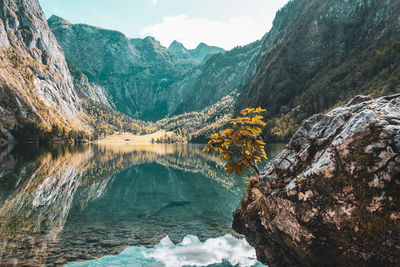 Scenic view of lake and mountains against sky