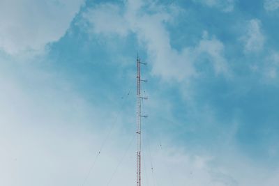 Low angle view of communications tower against sky