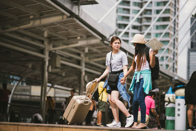 Tourists standing in city