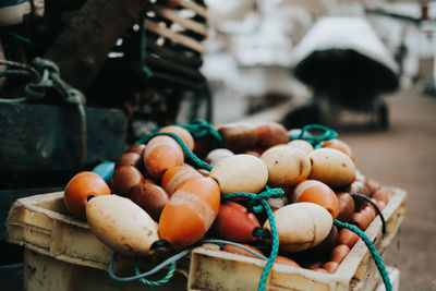 Close-up of buoys in basket