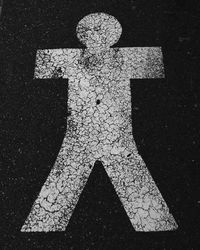 Close-up of arrow symbol on road