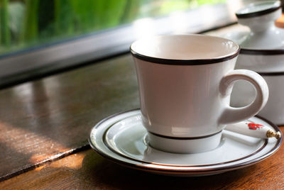 Close-up of coffee cup on table