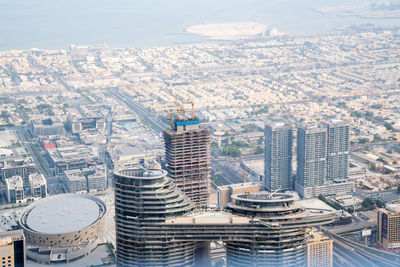 High angle view of buildings in city against sky