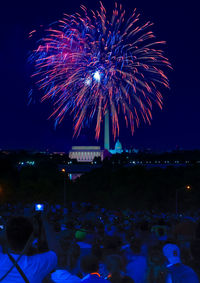 Firework display at night