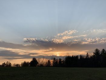 Scenic view of field against sky during sunset