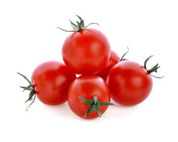 Close-up of tomatoes against white background