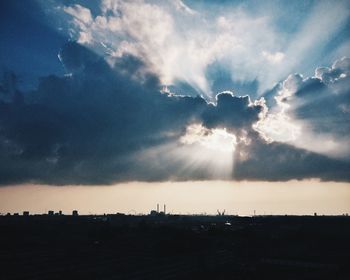 Scenic view of landscape against cloudy sky