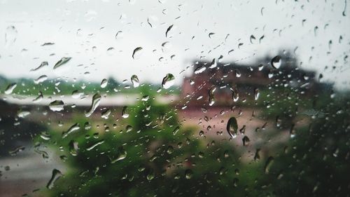 Full frame shot of wet glass window in rainy season