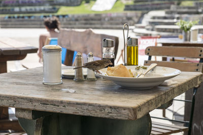 Sparrow on food at table