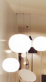 Close-up of electric lamp on table at home