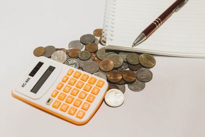 High angle view of coins on table