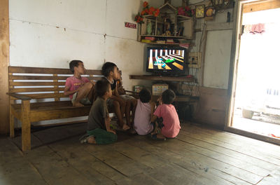 Children sitting in corridor