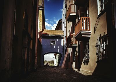 Street amidst buildings against sky