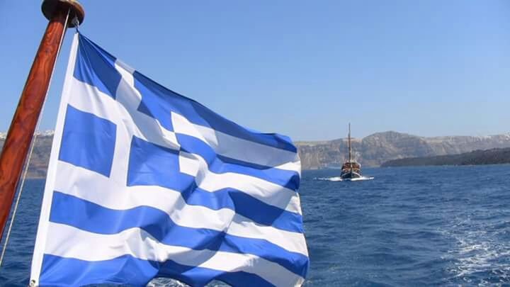 blue, nautical vessel, water, clear sky, sea, boat, transportation, sailboat, waterfront, mode of transport, sky, mast, flag, day, copy space, nature, tranquility, outdoors, rippled, beauty in nature