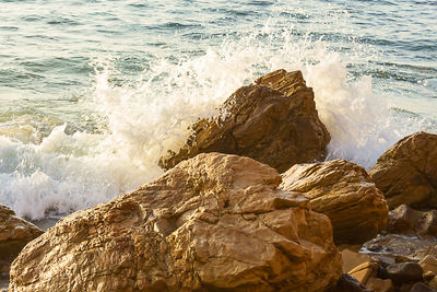 Waves splashing on rocks at shore