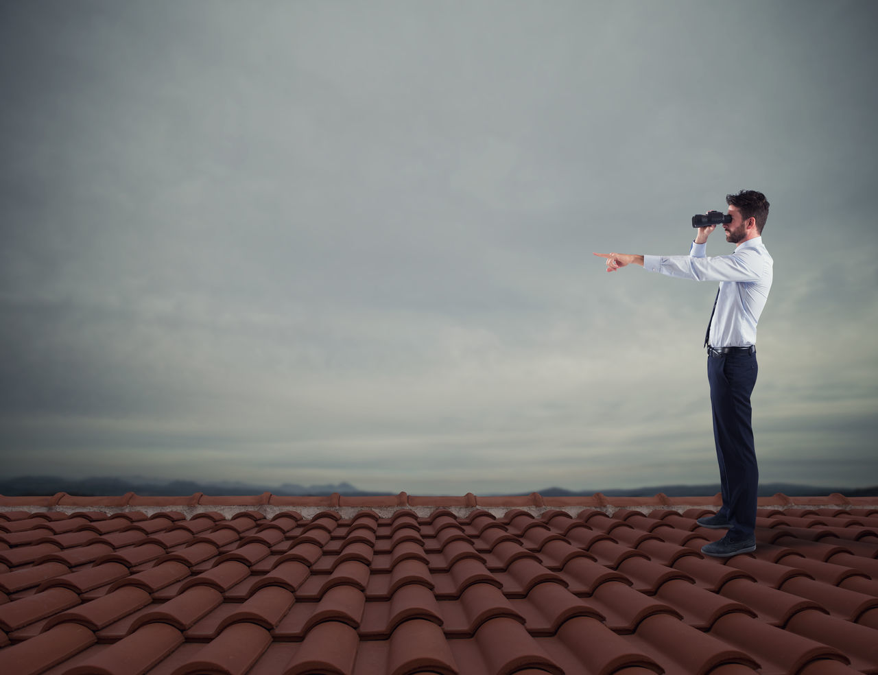 FULL LENGTH OF A MAN STANDING ON LAND AGAINST SKY