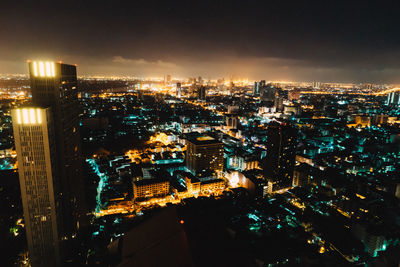 High angle view of illuminated cityscape at night